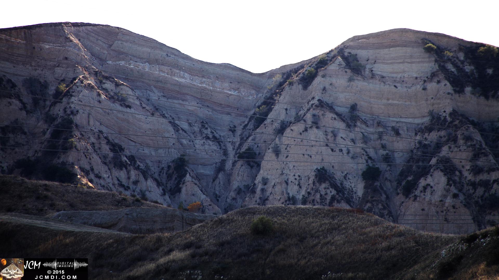 Landslide, buckled pavement, and terrain at Vasquez Canyon Road in Santa Clarita, CA filmed 11-25-2015